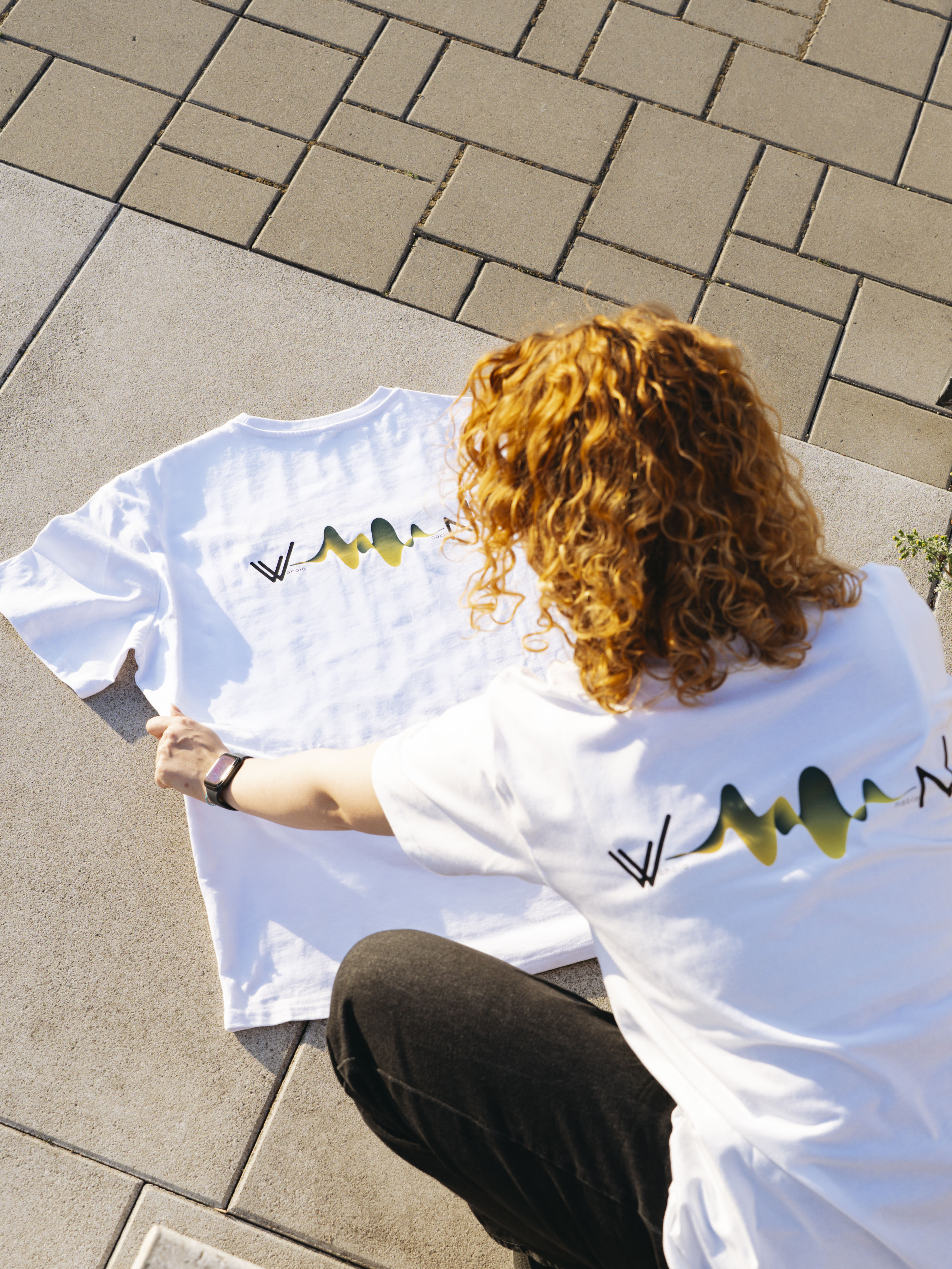White tee flat lay
